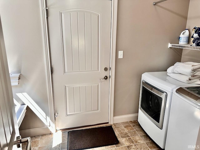 laundry area featuring independent washer and dryer and tile patterned floors