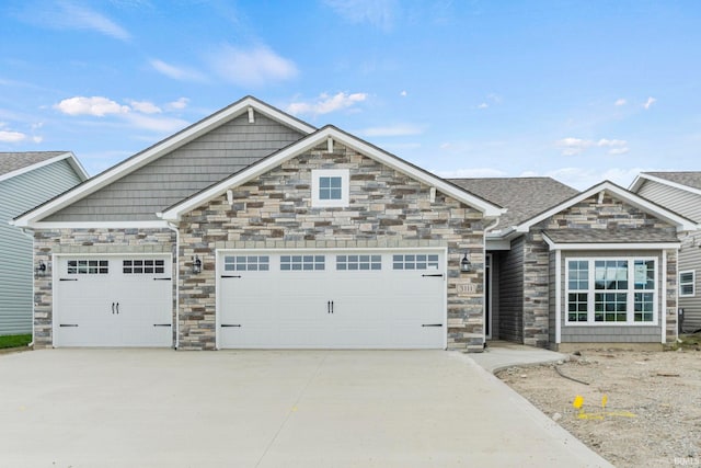 view of front facade with a garage and concrete driveway