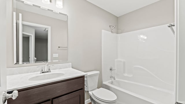 full bathroom with vanity, bathtub / shower combination, and toilet