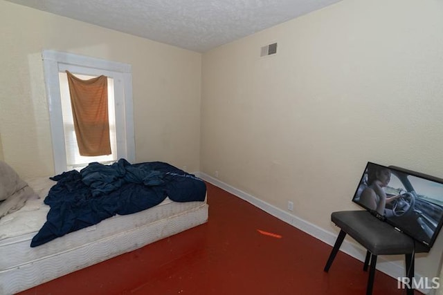 bedroom featuring a textured ceiling