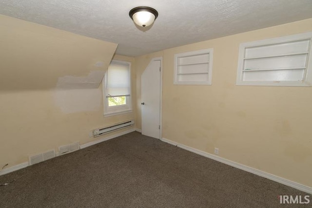 bonus room with a textured ceiling, a baseboard radiator, built in features, and carpet