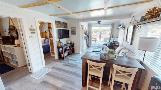 dining room featuring a ceiling fan and light wood-style floors