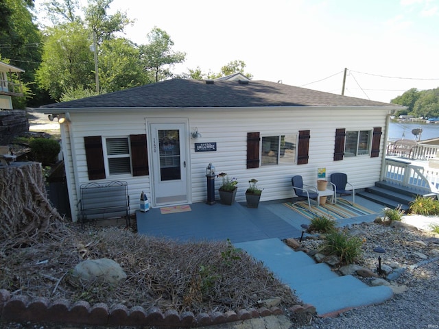 view of front of property with roof with shingles