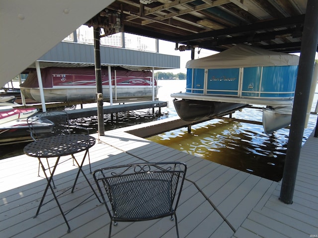 view of dock with a water view and boat lift