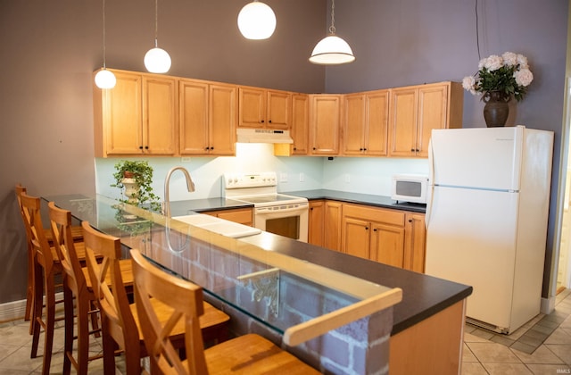 235 N Main St, Kokomo, IN 46901 - kitchen featuring white appliances, under cabinet range hood, a towering ceiling, light tile patterned floors, and light brown cabinets