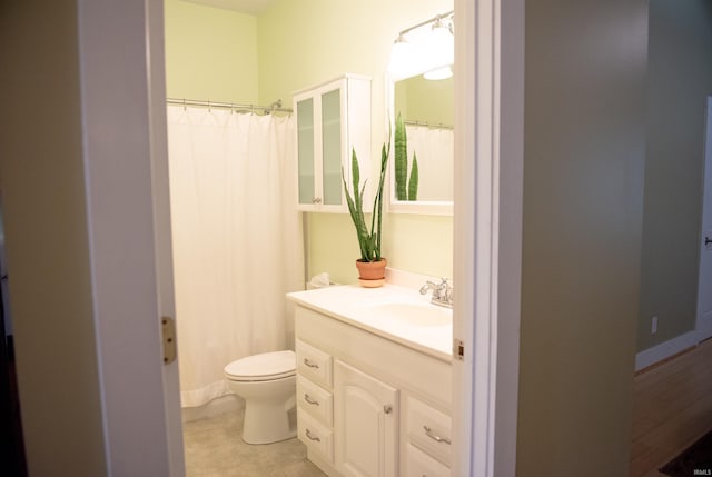 235 N Main St, Kokomo, IN 46901 - bathroom featuring toilet, vanity, and a shower with shower curtain