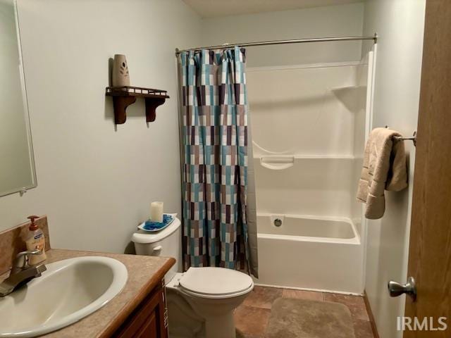 full bathroom featuring shower / tub combo with curtain, toilet, and vanity