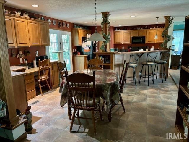 dining room with a textured ceiling