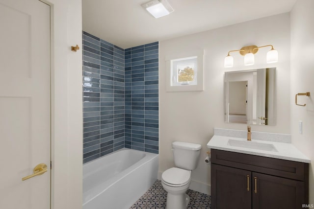 full bathroom with vanity, toilet, and tiled shower / bath combo