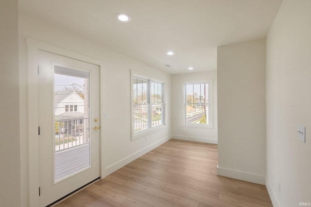 doorway to outside featuring light wood-type flooring