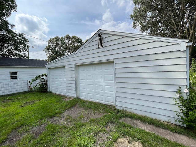 garage featuring a yard