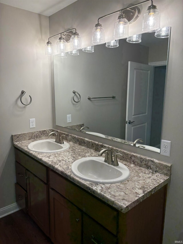 bathroom featuring hardwood / wood-style floors and vanity