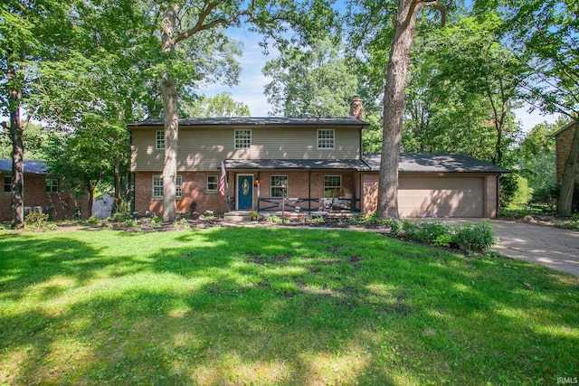 view of front of property with a garage and a front yard