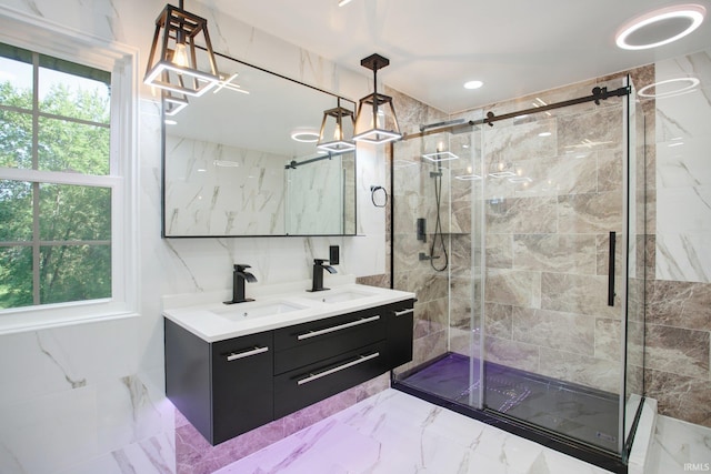 bathroom featuring double sink vanity, tile patterned floors, and a shower with door