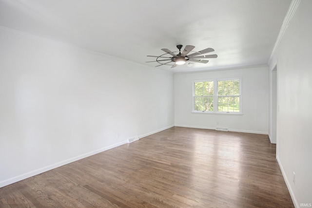 spare room with ceiling fan, ornamental molding, and hardwood / wood-style flooring