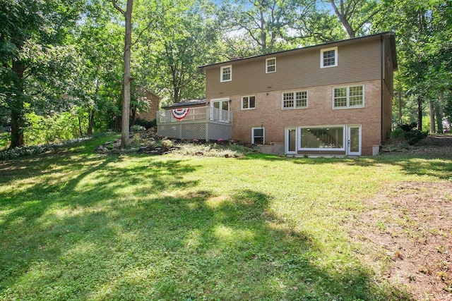 back of property featuring a lawn