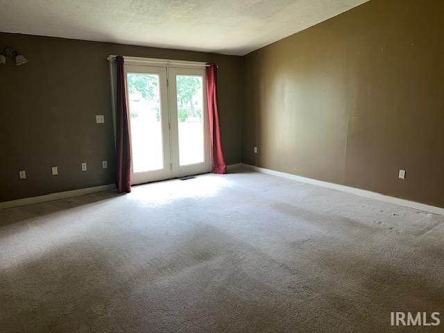 spare room with carpet flooring