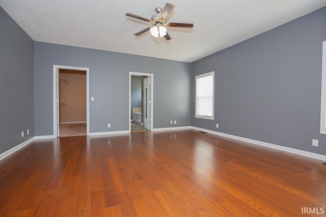 empty room featuring hardwood / wood-style floors and ceiling fan