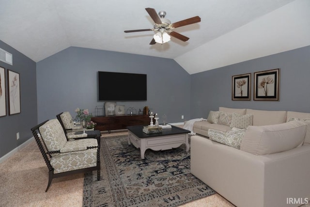 carpeted living room with baseboards, vaulted ceiling, and a ceiling fan
