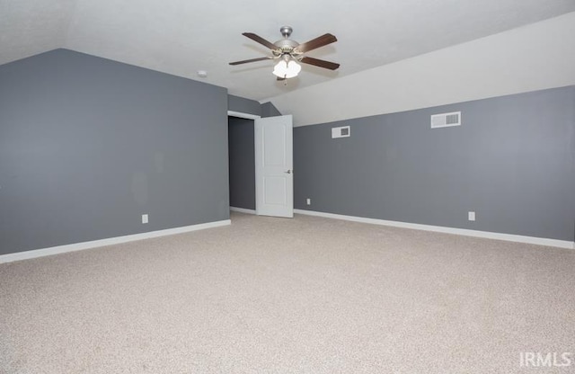 bonus room with ceiling fan, vaulted ceiling, and visible vents