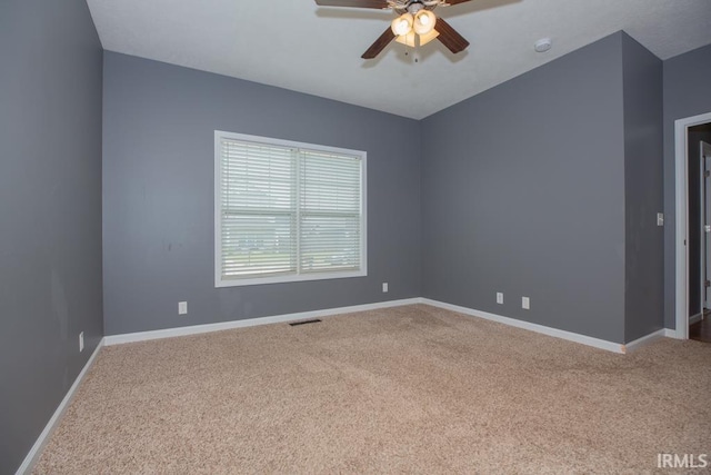 unfurnished room featuring carpet and ceiling fan