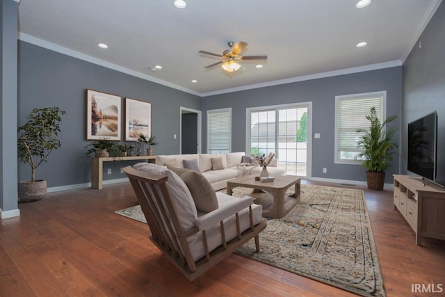 living room with baseboards, ceiling fan, crown molding, recessed lighting, and wood finished floors