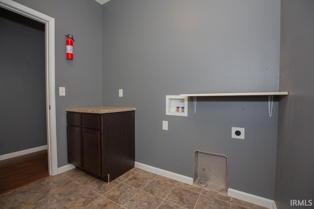 washroom featuring cabinets, hookup for a washing machine, and electric dryer hookup