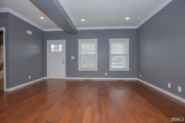 foyer entrance with beamed ceiling, hardwood / wood-style floors, and crown molding