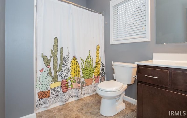 full bathroom featuring vanity, baseboards, curtained shower, tile patterned floors, and toilet