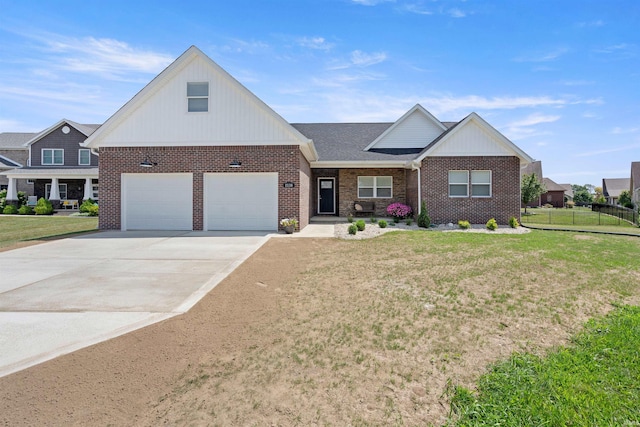 view of front of house with a front yard and a garage