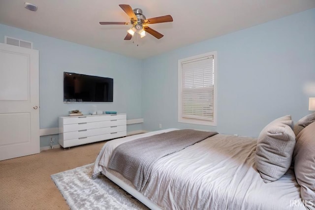 bedroom featuring ceiling fan and light colored carpet