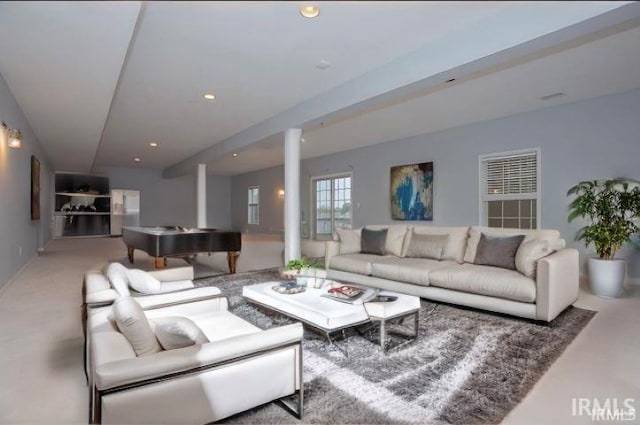 living room featuring decorative columns