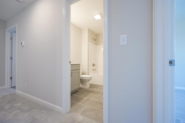 full bathroom with tile patterned flooring, vanity, shower / tub combination, and toilet