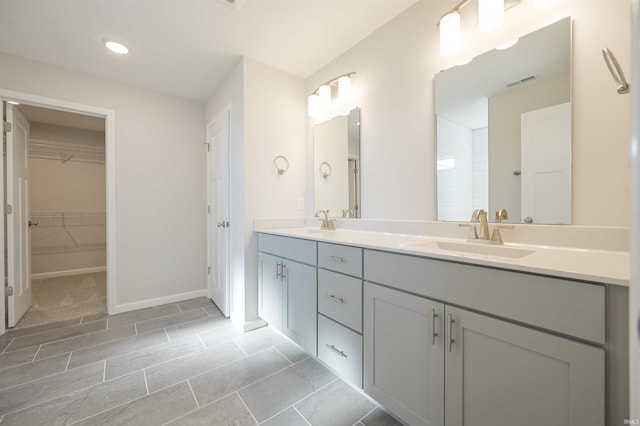 bathroom featuring tile patterned flooring and dual vanity