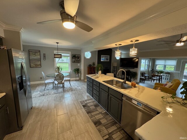 dining space with ceiling fan, light hardwood / wood-style floors, sink, and crown molding