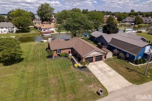 bird's eye view with a residential view and a water view