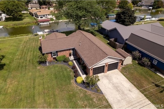 drone / aerial view with a residential view and a water view