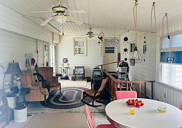 interior space with ceiling fan