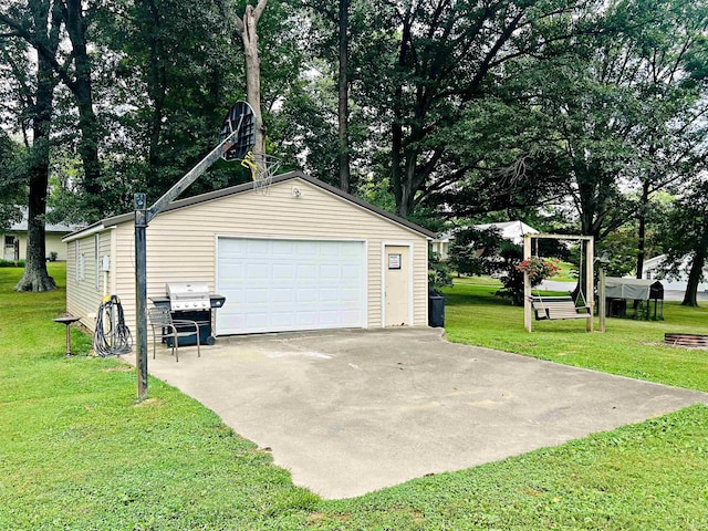 garage featuring a yard