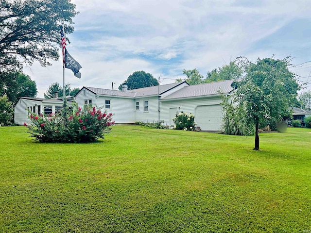 view of yard with a garage