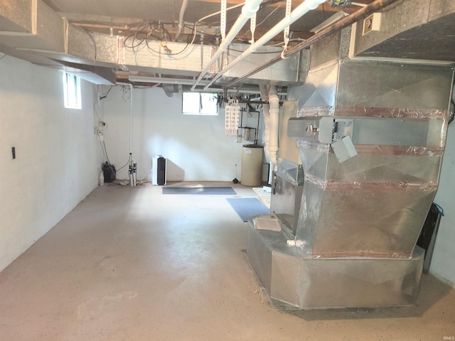 basement with heating unit and water heater