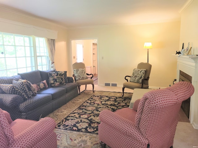 carpeted living room with ornamental molding