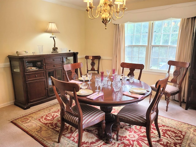 carpeted dining room with crown molding and a notable chandelier