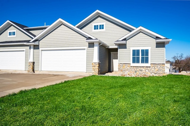 craftsman inspired home with a front yard and a garage