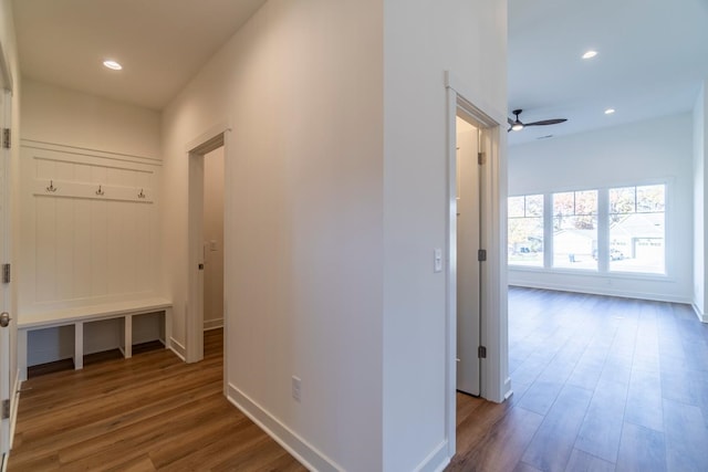 hallway with hardwood / wood-style floors