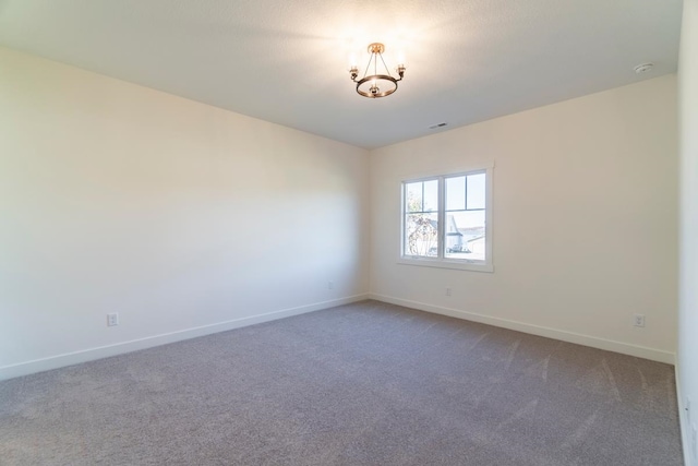 spare room featuring carpet floors