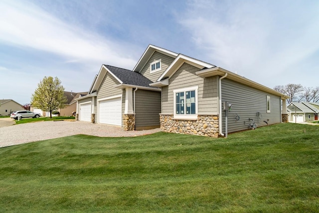 view of side of property featuring a yard and a garage