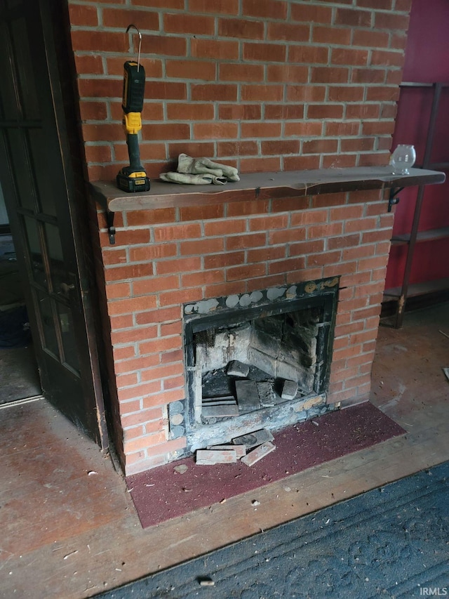 interior details with a brick fireplace