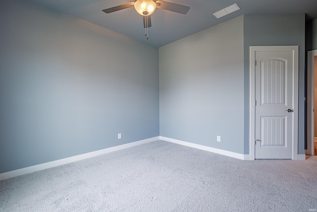 spare room with carpet floors and ceiling fan