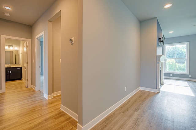 hall with light hardwood / wood-style floors